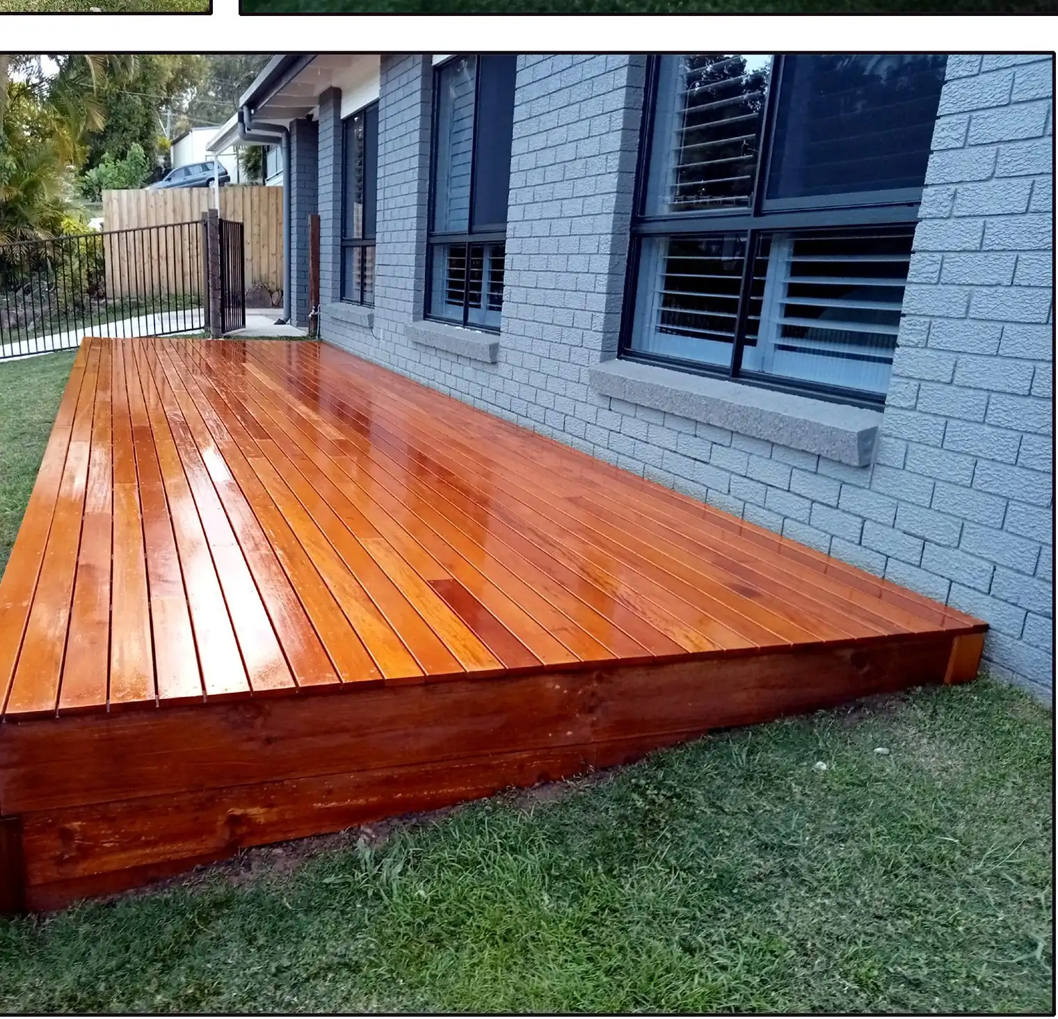 Custom hardwood timber deck built against a rendered Gold Coast home by Artisan Home Maintenance