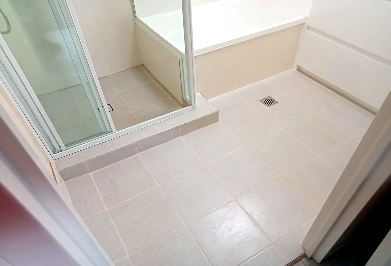 Walk-in shower and floor tiling Gold Coast - modern bathroom installation and waterproofing