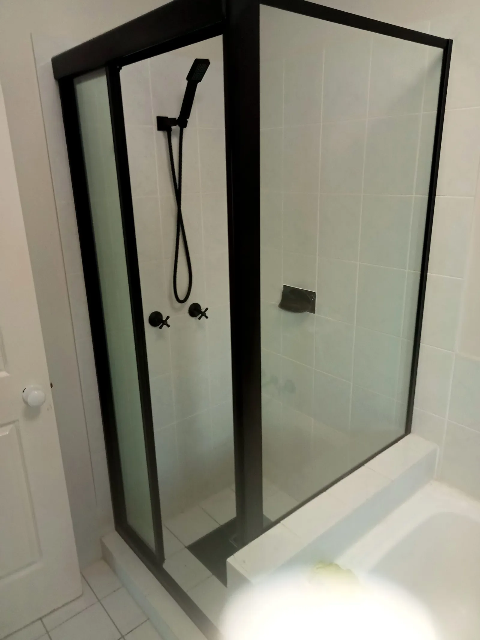 Shower screen replacement with black frame Gold Coast - modern bathroom upgrade and glass installation